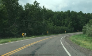 Roadway in Bayfield County with crumbling infrastructure