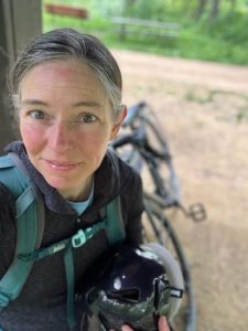 Susan Gaeddert taking a break on the Military Ridge Trail near Mt. Horeb, WI in early summer 2022. Photo by the author.
