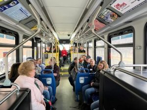 An electric bus full of eager Community Transportation Academy participants.