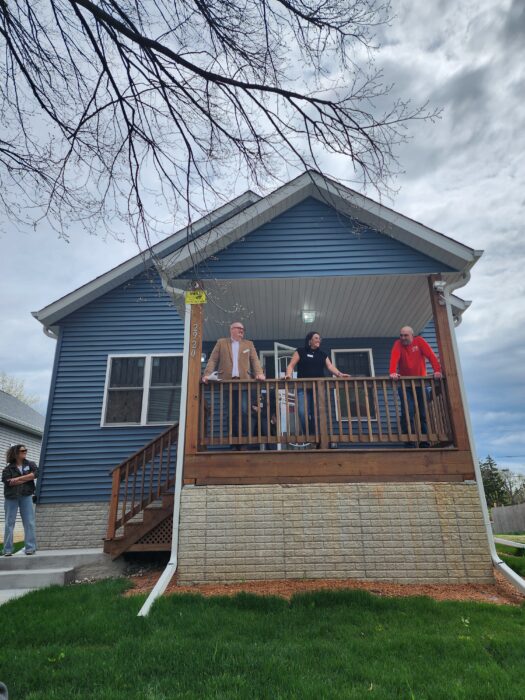 Community Development Alliance Bus Tour of new housing in Milwaukee, Wisconsin, visitors enjoy front porch view