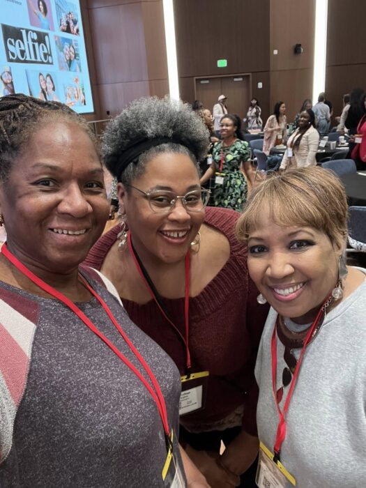 Sharon Johnson of Madison For More Neighbors, pictured with friends at the Wealth Empowerment Conference in Madison, Wisconsin