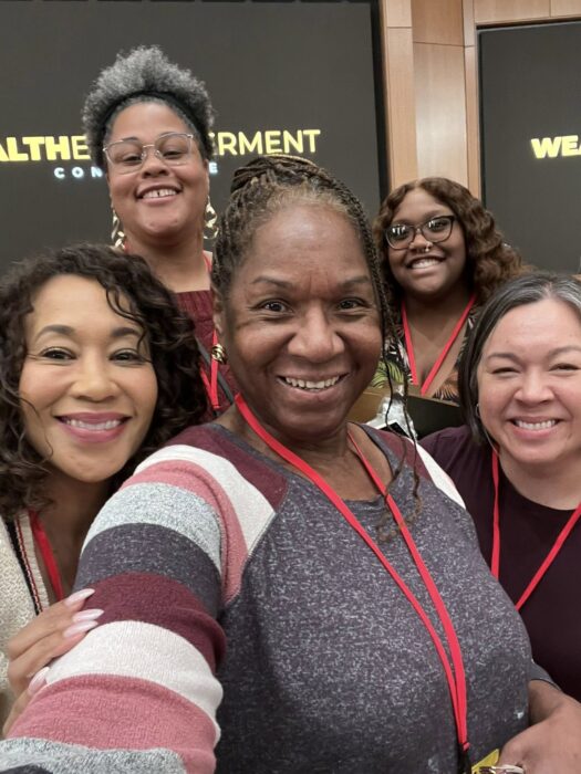 Sharon Johnson of Madison For More Neighbors, pictured with friends at the Wealth Empowerment Conference in Madison, Wisconsin