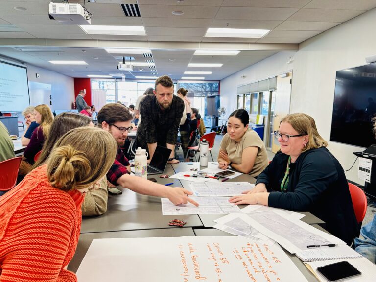 Chris McCahill leads a group discussion at Madison Community Transportation Academy