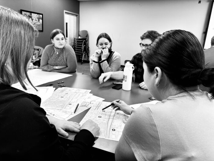 Black and White Image of discussions around Madison transportation priorities