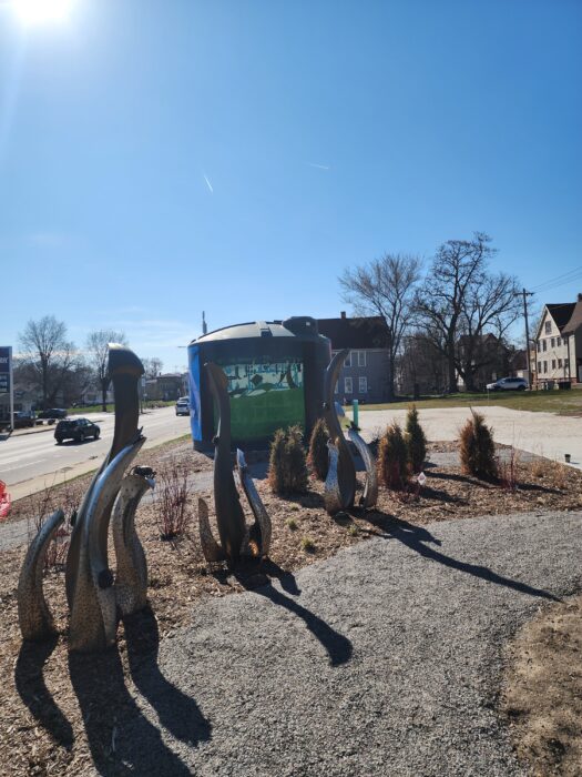 Painting. Beautified part of the northwest corner of the intersection of 35th and Vliet in Milwaukee with public art.