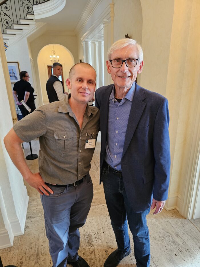 Trevor Roark, Executive Director of 1000 Friends of Wisconsin, pictured with Governor Evers at the Earth Day 2026 event in Madison, Wisconsin.