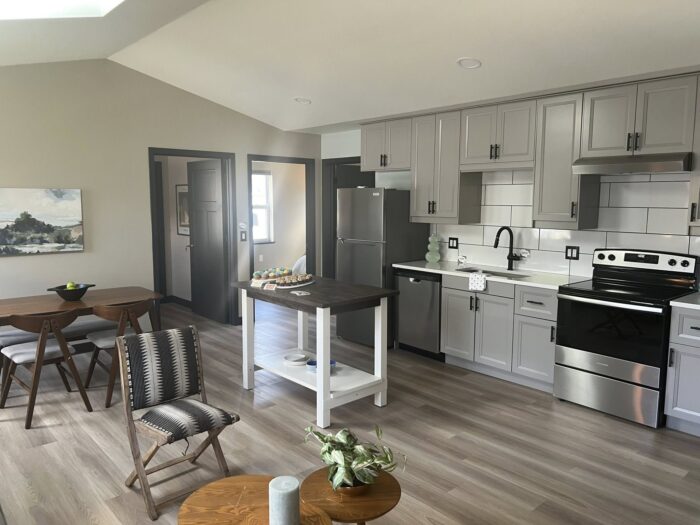 interior shot of open concept kitchen and living area, part of newly-constructed accessible ADUs in Madison, Wisconsin
