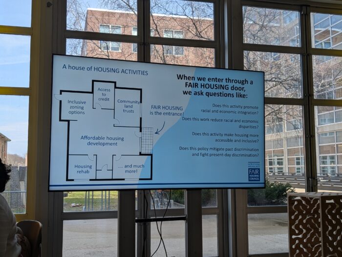 Presentation screen displaying housing goals at the “Housing Justice for Milwaukee: Community Land Trusts, Equity Strategies, and the Path to a Justice-Oriented City”