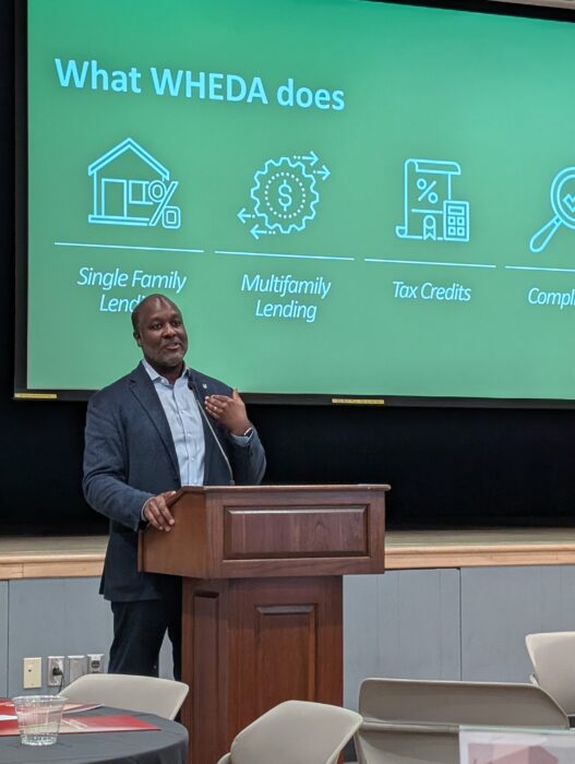 Elmer Moore, CEO and Executive Director of WHEDA, presents at Southeastern Wisconsin Housing Summit on May 7