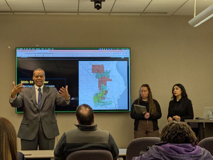 Dr. Kirk Harris shown with students Darya Salehi and Kelli Beine during 30th Street corridor presentations on May 14.