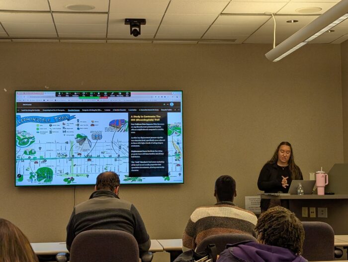 Kelli Beine presents to city officials and community members about the 30th Street Corridor plan in Milwaukee.