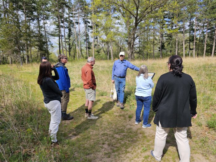 Participants walking in nature at Aldo Leopold Center