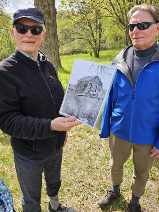 Two participants showing sketch of The Shack during the tour of Aldo Leopold Center