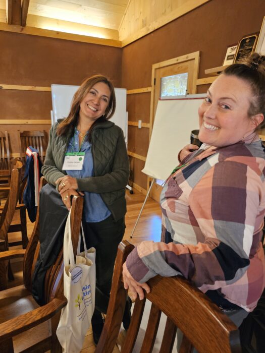 Participants at Wisconsin Climate Table Annual Gathering and Re-Amp Event smiling for camera
