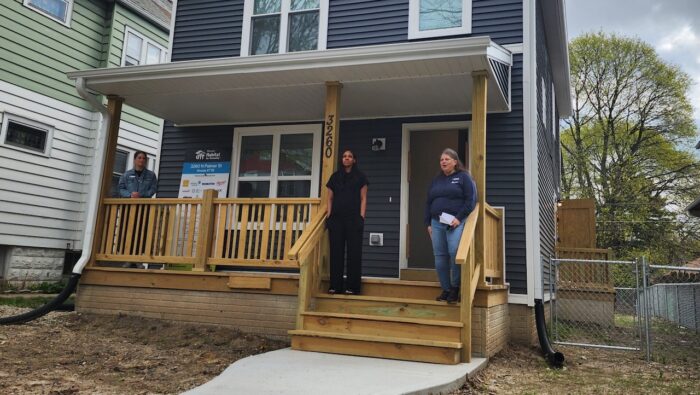 Habitat for Humanity Milwaukee affordable housing project, featuring homeowner and advocates on new front porch of home