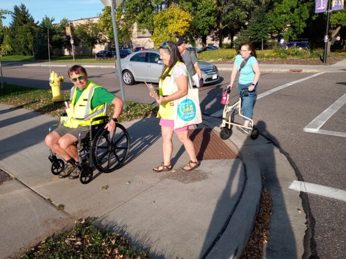 Walk and Roll audit, pedestrians crossing with walker and wheelchair assistance to better under accessibility requirements